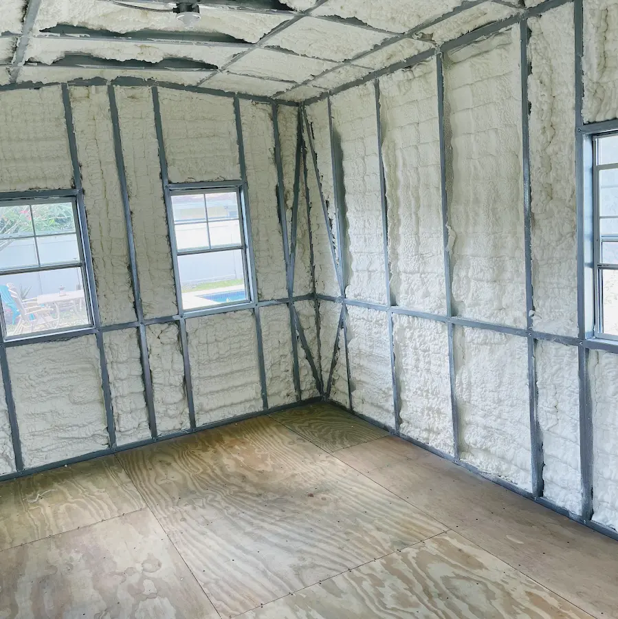 Closed-cell spray foam insulation applied to wall cavities in a residential project in Justice